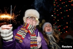 FILE - People celebrate New Year's Day in the arctic town of Vorkuta, 2,268 km (1,409 miles) northeast of Moscow, Jan. 1, 2010.