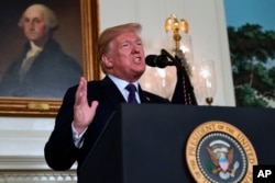 President Donald Trump speaks in the Diplomatic Reception Room of the White House, April 13, 2018, in Washington, about the United States' military response to Syria's chemical weapon attack on April 7.