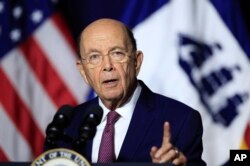 FILE - Department of Commerce Secretary Wilbur Ross speaks to department workers in Washington, July 16, 2018.
