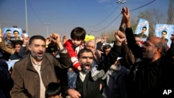 Iranian worshippers chant slogans during a rally against anti-government protestors after the Friday prayer ceremony in Tehran, Jan. 5, 2018. 