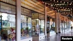 A mostly-empty city street is seen on the first day of a seven-day lockdown as the state of Victoria looks to curb the spread of a coronavirus disease (COVID-19) outbreak in Melbourne, Australia, May 28, 2021.