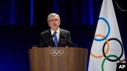 FILE - International Olympic Committee president Thomas Bach addresses the audience during the 142nd IOC session at the 2024 Summer Olympics, in Paris, France, Aug. 10, 2024.