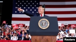 U.S. President Donald Trump reacts with supporters during a campaign rally in Panama City Beach, Fla., May 8, 2019. 