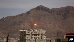 FILE - An explosion is seen following a Saudi-led airstrike in Sana'a, Yemen, Sept. 24, 2015.