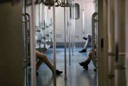 Women security personnel travel in a rapid metro train in Gurugram, outskirts of New Delhi, India, Sept. 7, 2020.
