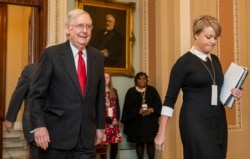 Senate Majority Leader Mitch McConnell walks from the Senate chamber as the impeachment trial of President Donald Trump continues on Capitol Hill in Washington, Jan. 22, 2020.