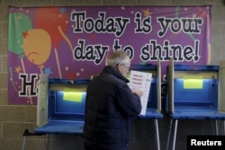 FILE - A man casts his ballot in the Wisconsin presidential primary in Milwaukee, Wisconsin, April 5, 2016. "People who are likely voters tend to be older, whiter, more financially secure,” says Carroll Doherty of the Pew Research Center.