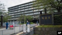 FILE - Japan's Foreign Ministry building with its sign at the main entrance in Tokyo on Sept. 17, 2021. The ministry charged that a Chinese survey ship entered Japan's territorial waters on Aug. 31, 2024.