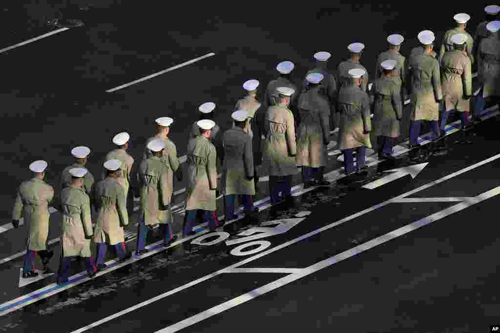 Members of the U.S. Navy line up to march with the casket of former President Jimmy Carter before it arrives at the U.S. Navy Memorial to travel to the Capitol in Washington to lie in state, Jan. 7, 2025. 