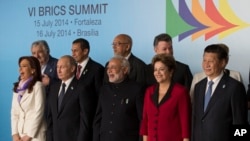 Leaders of the BRICS and South American nations pose for a group photo at the BRICS summit in Brasilia, Brazil, July 16, 2014.
