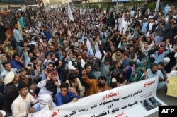 FILE - Pakistani activists of the Pashtun Tahafuz Movement take part in a protest against the arrest of party leader in Karachi on Jan. 23, 2019.