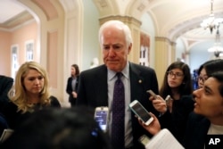 FILE - Senate Majority Whip John Cornyn of Texas talks with reporters on Capitol Hill in Washington, Jan. 3, 2017.