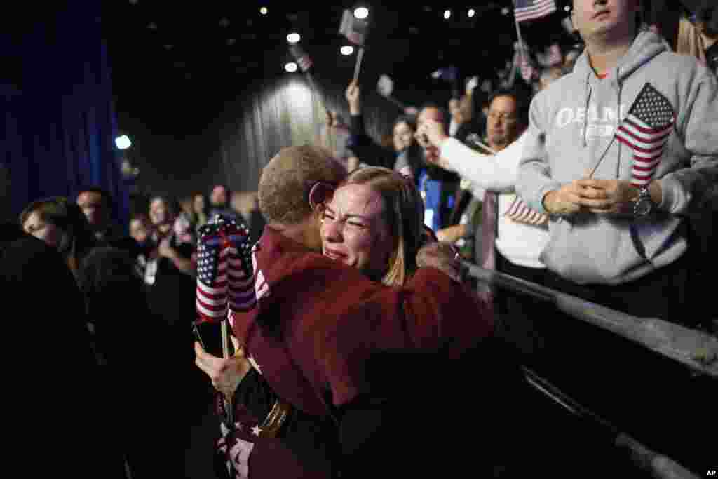 Supporters of President Barack Obama react to favorable media projections at the McCormick Place during an election night watch party in Chicago, Tuesday, Nov. 6, 2012. 