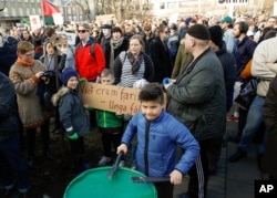 People gather to demonstrate against Iceland's prime minister, in Reykjavik on April 4, 2016.