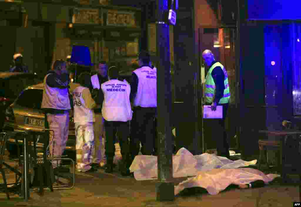 Medical staff stand by victims in a Paris restaurant, Nov. 13, 2015.