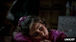Mariem, 8, a refugee from the Syrian Arab Republic, in her family’s shelter in Pikpa Village, an open refugee camp run by volunteers outside of Mytilini, Lesvos, Greece, Tuesday 14 March 2017.