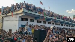 Pakistan Tehreek-e-Insaaf (PTI) party's chairman and barrister Gohar Ali Khan's supporters attend an election campaign rally in Buner, Pakistan, on Feb. 5, 2024, ahead of the national elections.