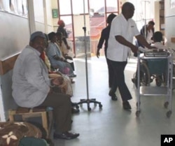 People await attention from a general practitioner in a public hospital in South Africa, which is enduring serious shortages of doctors