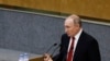 Russian President Vladimir Putin speaks a session prior to voting for constitutional amendments at the State Duma, the Lower House of the Russian Parliament in Moscow, Russia, Tuesday, March 10, 2020.