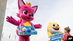 Pinkfong and Baby Shark cheer on the Washington Nationals with fans of all ages ahead of Game 3 of the World Series, Oct. 25, 2019.