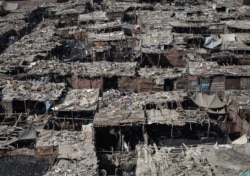 FILE - A general view of Ezbet al-Nakhl, a shanty town north of the Egyptian capital Cairo, is seen Oct. 13, 2018.
