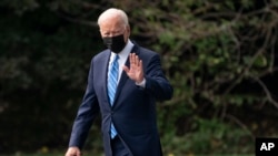 FILE - President Joe Biden walks to board Marine One on White House grounds, in Washington, Oct. 7, 2021. 
