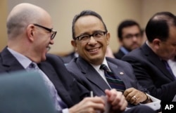 Carlos Gonzalez Gutierrez, center, Mexico's consul general in Austin, waits to give testimony to the Committee on International Trade and Intergovernmental Affairs at the Texas Capitol, March 6, 2017, in Austin, Texas. Officials from Mexico and Texas are urging the state's lawmakers to defend the North American Free Trade Agreement against President Donald Trump's administration, which has been wary of it.