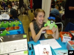 Danielle Corsetto, creator of 'Girls with Slingshots,' earns income from ads as well as from the sale of comic-inspired merchandise.