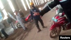 Employees gather amid clashes between Chinese and Indonesian workers at a nickel smelter in Morowali, Sulawesi, Indonesia in this undated social media video released Jan. 16, 2023. Revi Limbong via REUTERS