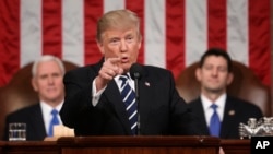 President Donald Trump addresses a joint session of Congress on Capitol Hill in Washington, Feb. 28, 2017. Vice President Mike Pence and House Speaker Paul Ryan of Wisconsin listen.