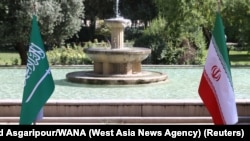 FILE - A view of the flags of Iran and Saudi Arabia in Tehran, Iran, June 17, 2023. The chief of staff of Saudi Arabia's armed forces, Fayyad al-Ruwaili, visited Tehran, Nov. 10, 2024, to meet with his Iranian counterpart and discuss defense ties, state media reported.