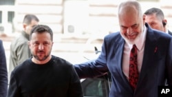 Albanian Prime Minister Edi Rama, right, welcomes Ukrainian President Volodymyr Zelenskyy before their meeting in Tirana, Albania, Wednesday, Feb. 28, 2024. Albania hosts on Thursday a summit of Southeastern European countries on peace, security and cooperation. 