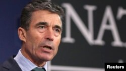 FILE - NATO Secretary-General Anders Fogh Rasmussen