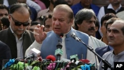 Nawaz Sharif addresses a crowd during his visit to a mausoleum of Pakistani poet Mohammad Iqbal on Pakistan Independence Day in Lahore, Aug. 14, 2017.