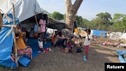 FILE - People look on at makeshift shelters near Awlala Camp, Amhara region, Ethiopia, May 31, 2024. UNICEF reported on Jan. 7, 2025, that 4.4 children in Amhara are unschooled due to disasters and violence. (Alfatih Alsemari via Reuters)