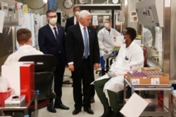 Vice President Mike Pence visits the molecular testing lab at Mayo Clinic Tuesday, April 28, 2020, in Rochester, Minn., where he toured the facilities supporting COVID-19 research and treatment.