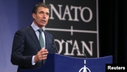 FILE - NATO Secretary-General Anders Fogh Rasmussen