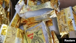 FILE - Malaysian Customs display 1,187kg of Methamphetamine worth 71 million ringgit ($17.8 million) seized during a news conference in Nilai, Malaysia, May 28, 2018. 