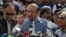 FILE - Nawaz Sharif addresses a crowd during his visit to a mausoleum of Pakistani poet Mohammad Iqbal on the occasion of Pakistan Independence Day in Lahore, Aug. 14, 2017.