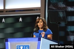First lady Michelle Obama, speaking at the Democratic National Convention in Philadelphia, Pa., tells the audience, 'Don't let anyone ever tell you that this country isn't great.' (A. Shaker/VOA)