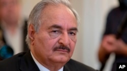 FILE - Khalifa Hifter, commander of the Libyan Arab Armed Forces, shown Aug. 14, 2017, in Moscow. Hifter’s east-based forces have announced that they will abide by a Russia and Turkish-brokered cease-fire starting Sunday, in a last-minute reversal.