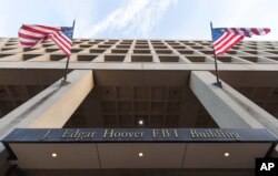 The Pennsylvania Avenue entrance of the J. Edgar Hoover Federal Bureau of Investigations (FBI) Building is seen in Washington, Nov. 30, 2017.