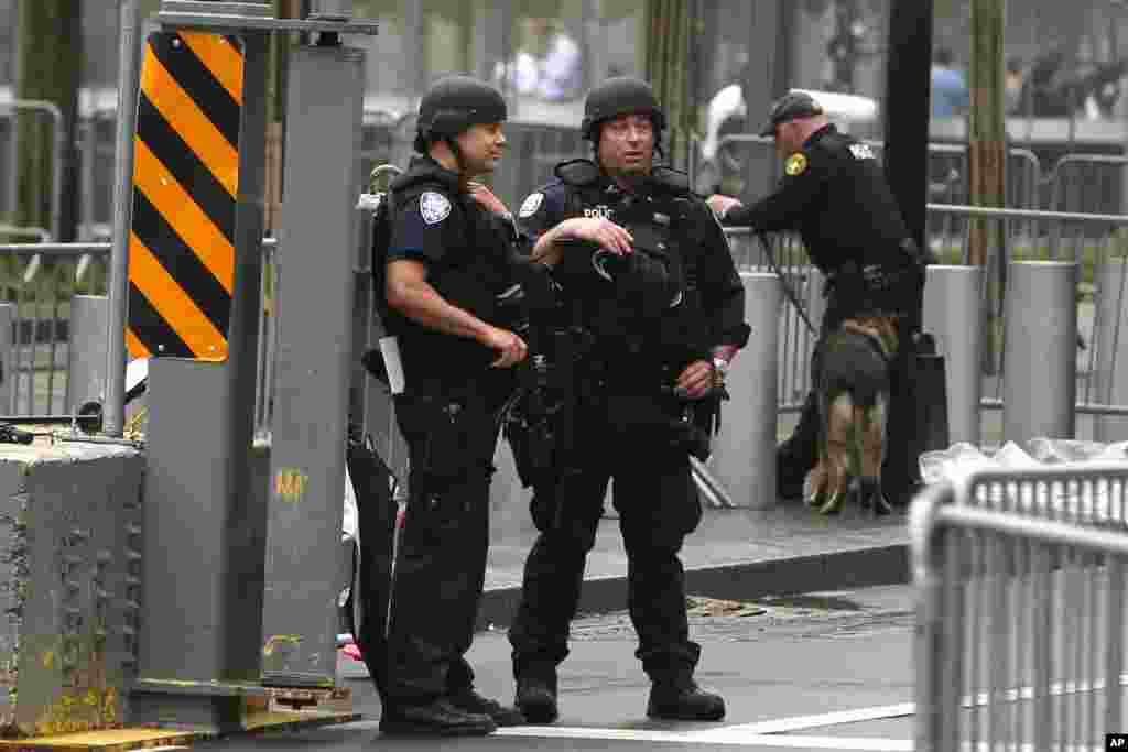 Heavily armed police officers stand guard outside the World Trade Center before President Obama's arrival for the dedication ceremony of the National September 11 Memorial Museum, New York City, May 15, 2014.