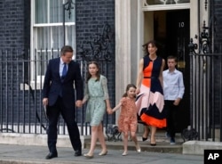 Britain's Prime Minister David Cameron, his wife Samantha and their children Nancy, Florence and Elwen, from left, leave 10 Downing Street, in London, July 13, 2016.