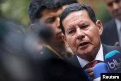 FILE - Brazil's Vice President Hamilton Mourao speaks to the media in Bogota, Colombia, Feb. 25, 2019.