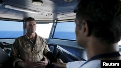 FILE - U.S. Navy Rear Admiral Andrew Lewis speaks during an interview on the bridge of the USS Theodore Roosevelt (CVN-71) aircraft carrier.