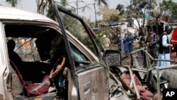 Afghan security personnel work at the site of an explosion in Kabul, Afghanistan, Sept. 9, 2020.