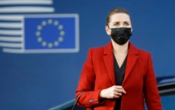FILE - Danish Prime Minister Mette Frederiksen arrives for an EU summit in Brussels, Oct. 22, 2021.