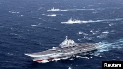 China's Liaoning aircraft carrier with accompanying fleet conducts a drill in an area of South China Sea, in this undated photo taken December 2016.