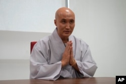 NewJeansNim, a comedian and a DJ, whose real name is Youn Sung Ho, poses during an interview with The Associated Press in Seoul, South Korea, on May 7, 2024. (AP Photo/Ahn Young-joon )